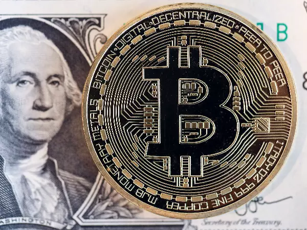 Image d'un token Bitcoin et d'un dollar américain